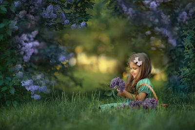 Portrait of a girl sitting in the garden