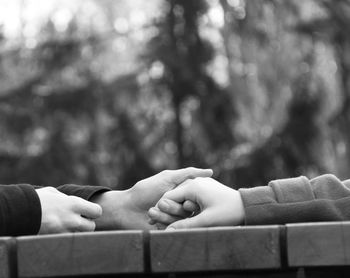 Couple holding hands at table