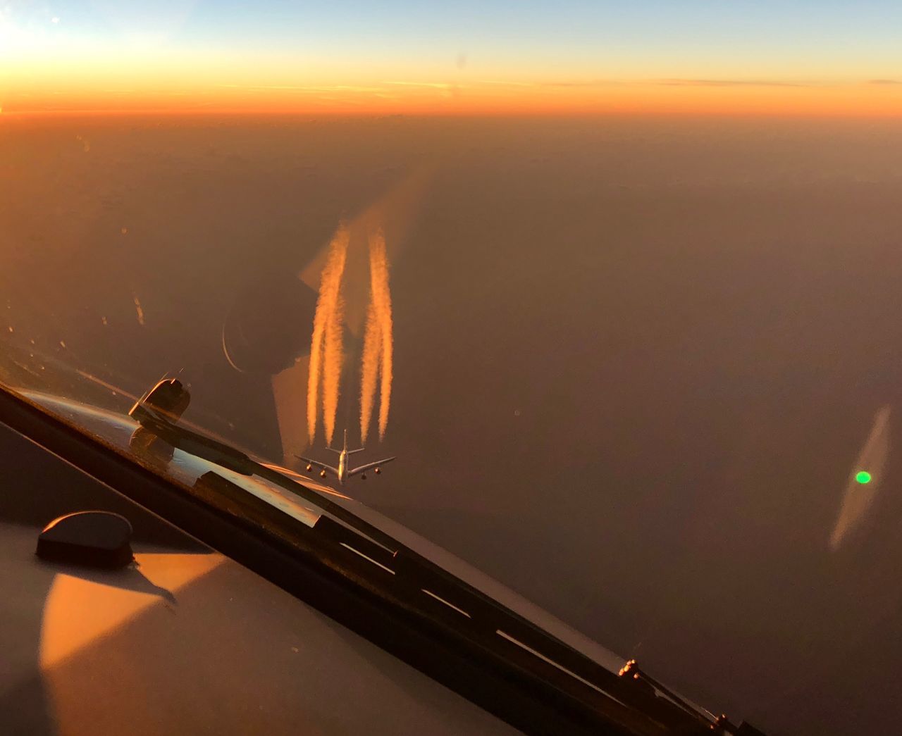 AERIAL VIEW OF ILLUMINATED WINDOW AT SUNSET