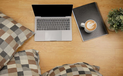 High angle view of coffee cup on table