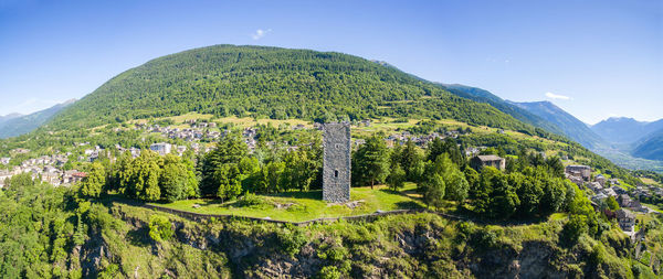 Panoramic view of trees and mountains against sky