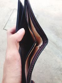 Cropped hand holding wallet