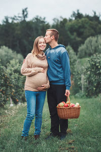 Young couple kissing in basket