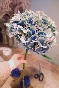 Close-up of hand holding bouquet