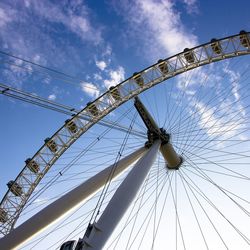 Low angle view of ferris wheel against sky