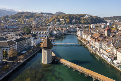 Switzerland, canton of lucerne, lucerne, aerial view of historic chapel bridge in autumn