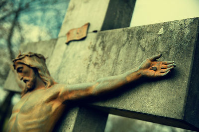 Low angle view of statue against wall