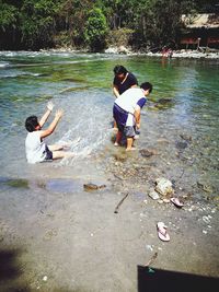 People and woman in water