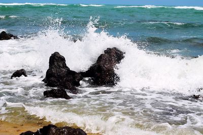 Waves splashing on rocks