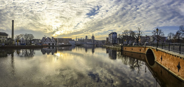 Panoramic view of bridge over river against sky