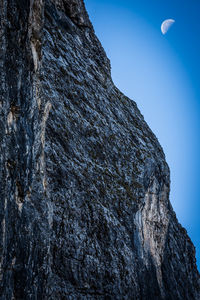 Low angle view of rock formation against sky