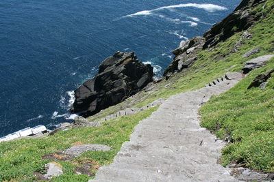 High angle view of steps on mountain at sea shore