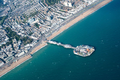 High angle view of sea by city