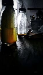 Close-up of wine bottles on table