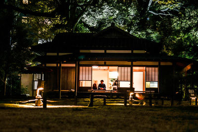 People sitting outside building