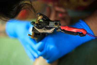 Close-up of tattoo artist working on customer