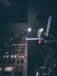 High angle view of illuminated street and buildings at night