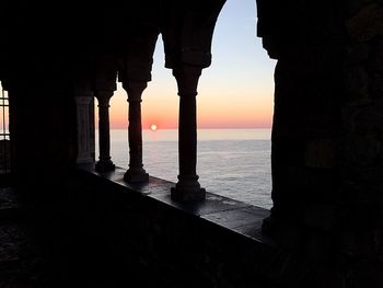 Silhouette of historical building against sky during sunset