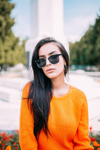 Portrait of young woman wearing sunglasses