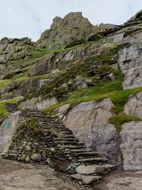 Rock formations on mountain against sky