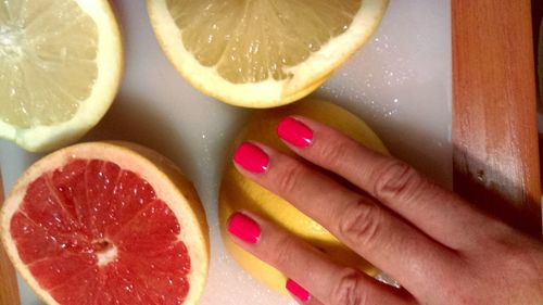 Close-up of hand holding fruits