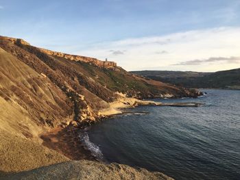 Scenic view of bay against sky