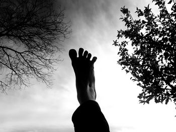 Low angle view of silhouette person against sky