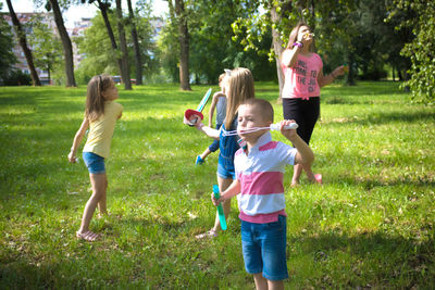 Group of children having fun while playing in nature.