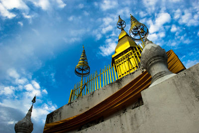 Louangphabang high point of the temple against blue sky and clouds