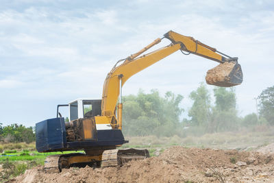 Construction site on field against sky