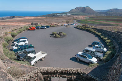 High angle view of vehicles on road against sky