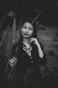 Portrait of smiling young woman standing outdoors