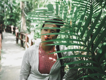 Portrait of boy looking at plants