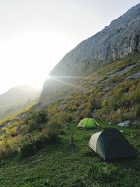 Tent against mountain