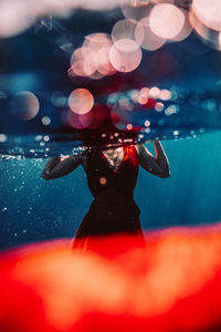 Close-up of woman swimming in pool