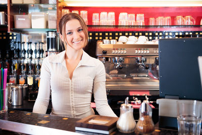 Woman standing in front of restaurant