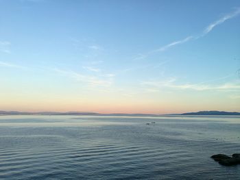 Scenic view of sea against sky at sunset