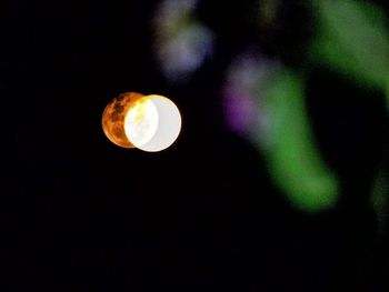 Low angle view of illuminated lights at night