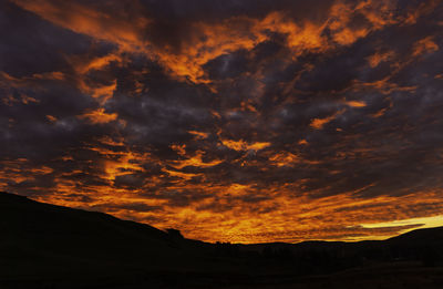 Low angle view of dramatic sky during sunset