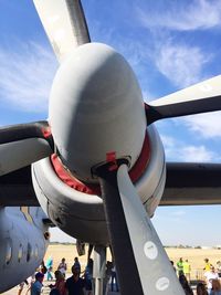 Low angle view of airplane on airport runway against sky