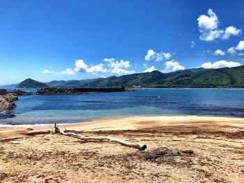 Scenic view of sea against blue sky