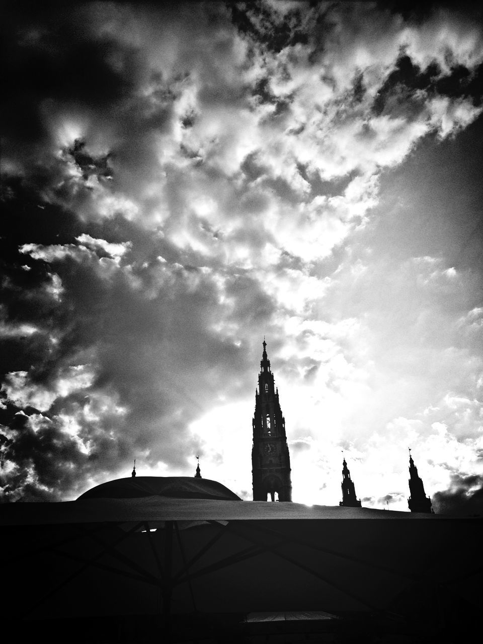 architecture, building exterior, built structure, sky, low angle view, cloud - sky, cloudy, church, place of worship, cloud, religion, high section, spirituality, silhouette, outdoors, day, tower, no people