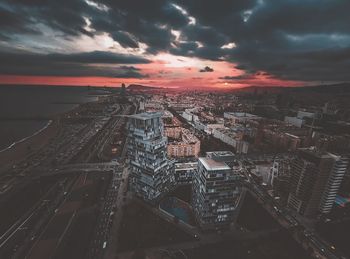 High angle view of city buildings during sunset