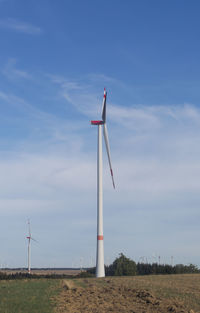 Wind turbine on a field 
