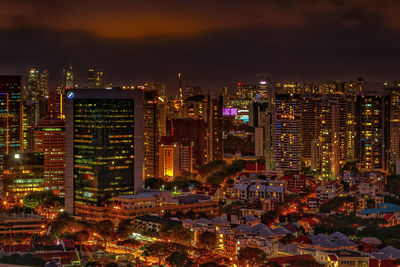 Illuminated cityscape against sky at night