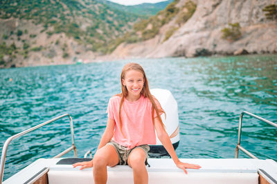 Portrait of a smiling young man in boat