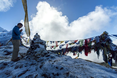 Man standing on snow against sky