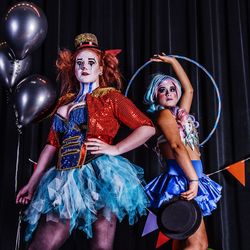 Women in costume standing on stage