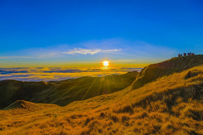 Scenic view of landscape against sky during sunset