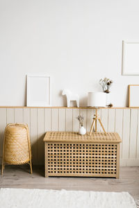 Table lamp, lavender in a white vase in the decor of the living room in a minimalist scandinavian 